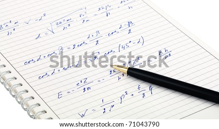 The writing-notebook used up by formulas, on a writing-notebook lays a ball pen.  Closeup
