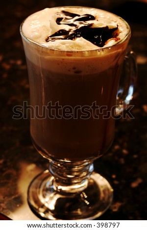 Coffee mocha drink topped with chocolate syrup