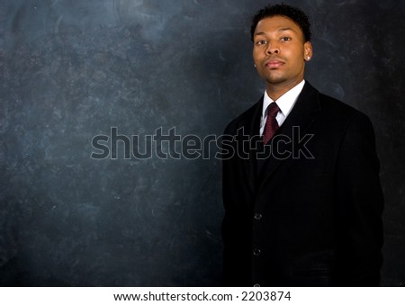 Portrait of an African American man in a business suit. Copyspace on the left.