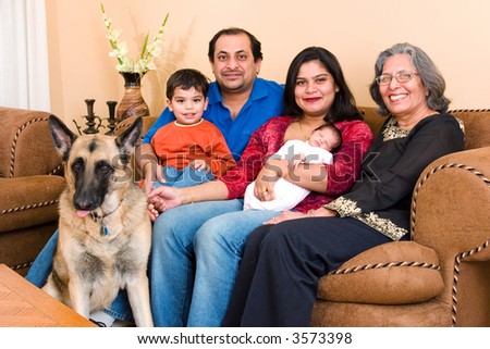 An East-Indian family sits in their living room