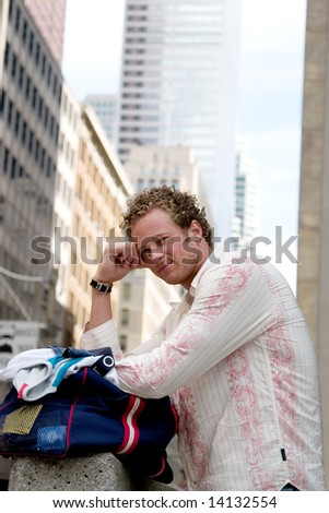 A young man with his clothes bag