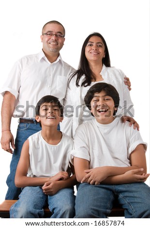 An Indian Family All Pose Together In A Fun Setting Stock Photo