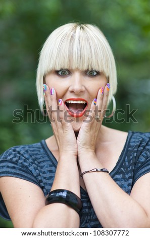 attractive woman making emotional reaction and surprised face expression