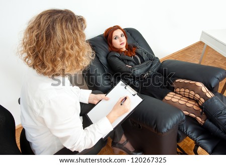 stock-photo-troubled-teen-girl-on-therapy-or-counseling-session-120267325.jpg
