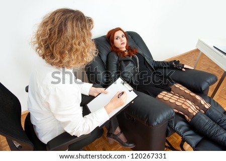 troubled teen girl on therapy or counseling session