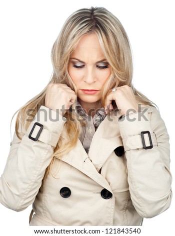 attractive blond woman making sad facial expression isolated