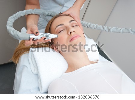 attractive woman in beauty salon on face lifting and anti wrinkles therapy