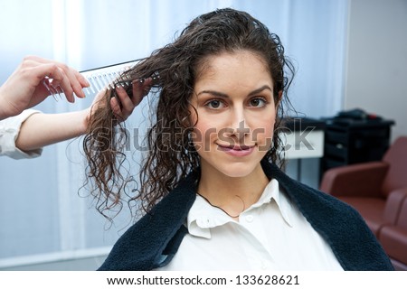 attractive woman in hair salon on hair treatment
