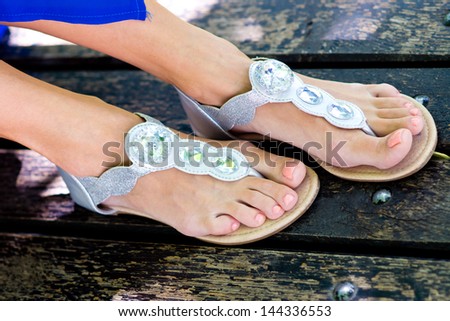woman feet in modern summer sandals