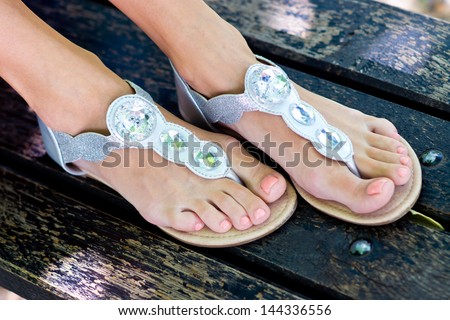 woman feet in modern summer sandals