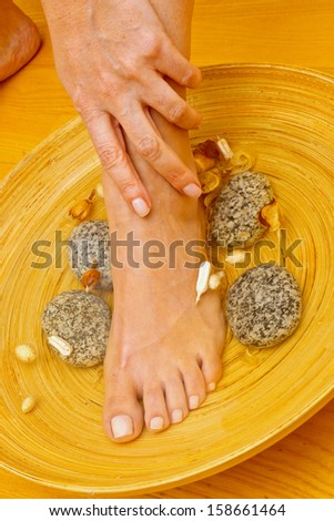 Closeup of a female feet at spa salon on pedicure