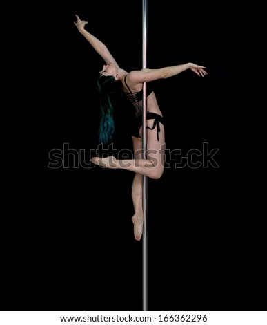 attractive sexy woman pole dancer performing element