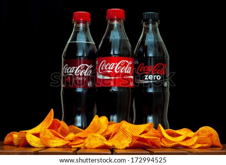 ZAGREB , CROATIA - JANUARY 24 ,2014 :  plastic bottles of soft drink coca-cola , coca-cola zero and coca-cola cherry by coca-cola company on black background, product shot