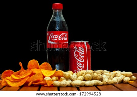 ZAGREB , CROATIA - JANUARY 24 ,2014 :  soft drink coca-cola in can and plastic bottle by coca-cola company on black background, product shot