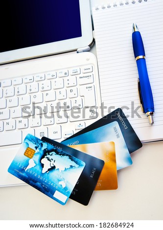 credit cards on computer keyboard , concept for internet shopping