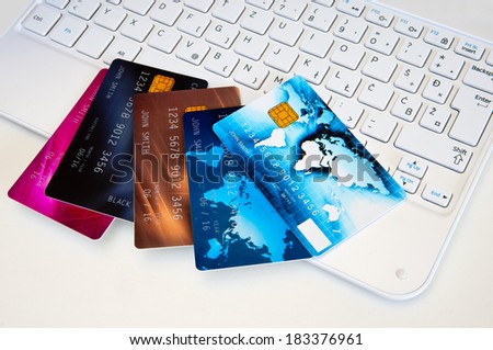 credit cards on computer keyboard , concept for internet shopping