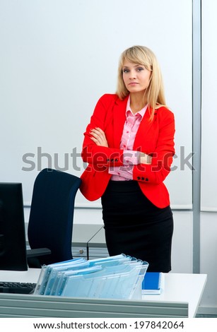 attractive blonde business woman in office workstation with computer