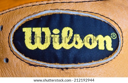 ZAGREB , CROATIA - AUGUST 21 , 2014 : Wilson sport brand logo on baseball leather glove close up , product shot