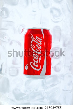 ZAGREB , CROATIA - SEPTEMBER 17. 2014 -  Coca Cola can in the ice water, refreshing drink , product shot