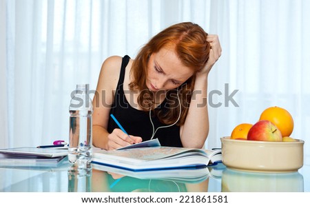 attractive red hair freckled woman study at home , home education and learning
