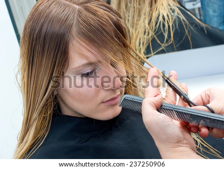 attractive woman having haircut in salon