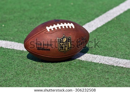 ZAGREB , CROATIA - 13 AUGUST 2015 -  official ball of the NFL football league , the Duke on grass turf background , product shot
