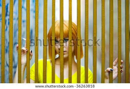 girl with cigarette in golden cage