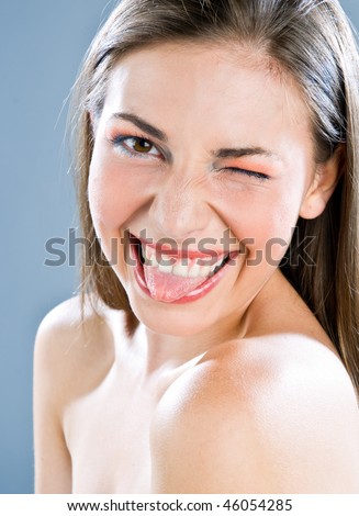 stock photo teen girl pulling tongue and winking