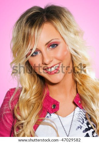 stock photo blonde teen girl smiling with interesting hair style