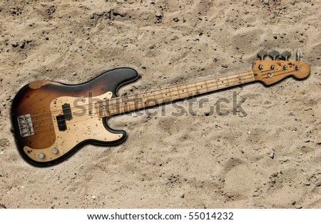 Aterramento de Contra baixo. Stock-photo-bass-guitar-buried-in-the-sand-55014232