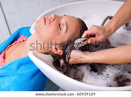 woman washing hair in hair-salon pool
