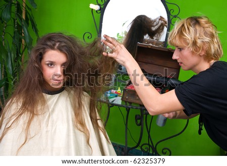 stylist work on woman messy hair in salon