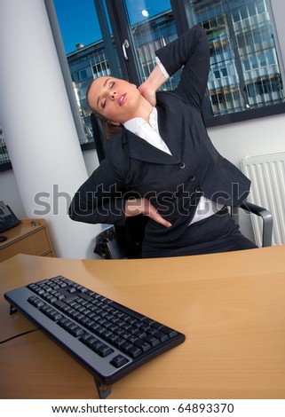 business woman stretching in office