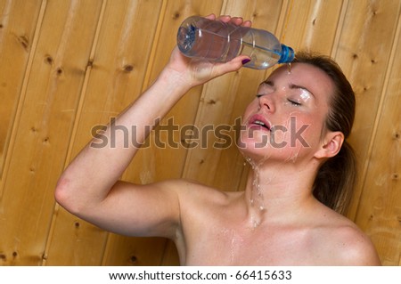 woman splash water on her face in sauna