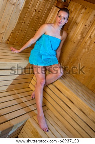 attractive woman sweating in sauna