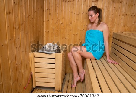 attractive woman sweating in sauna