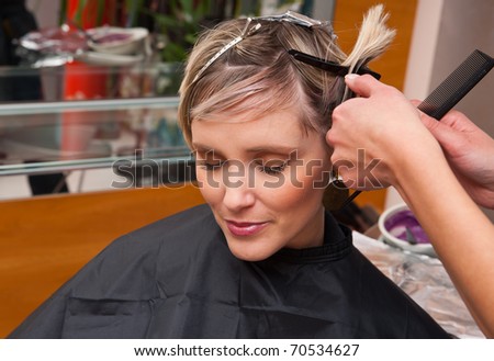 woman in salon making new hair style