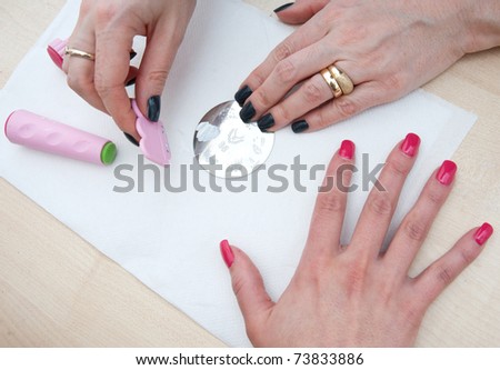 stylist preparation for stamping woman finger nails