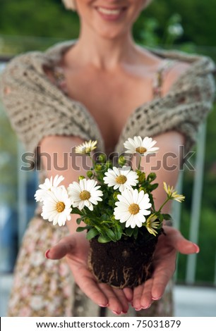 woman hands gentle holding new plant