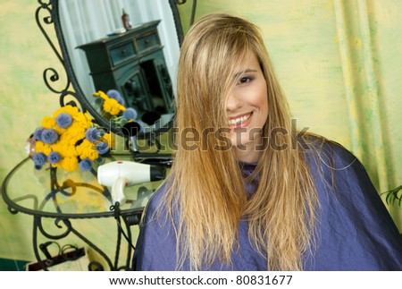 woman in hair salon with messy hair waiting for haircut