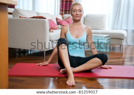 attractive woman waking up and stretching in her bed