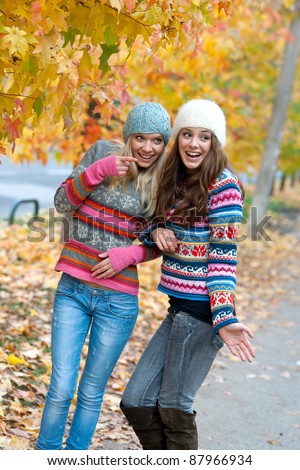 two teen girls chatting smiling and having fun