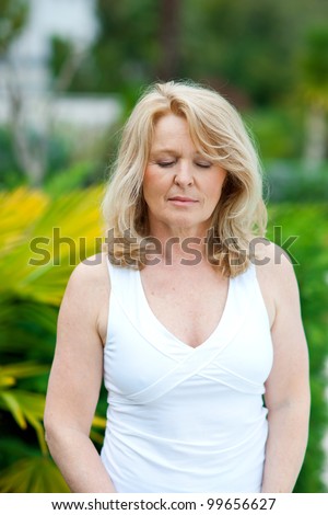 mature woman natural beauty portrait with closed eyes outside
