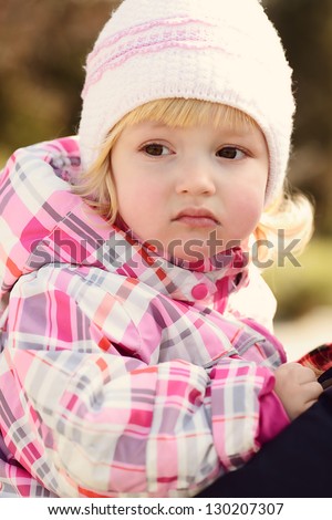 portrait  of toddler girl wearing win?er clothing