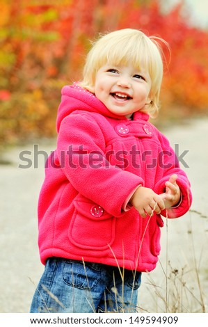 cute toddler girl in fall park
