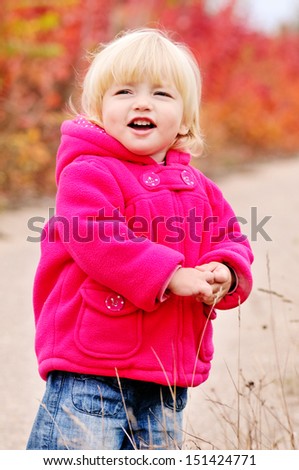 cute toddler girl in fall park