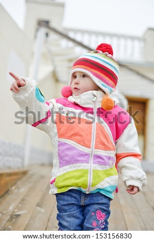 winter toddler girl point with finger