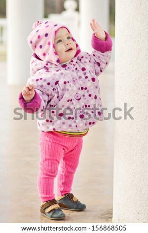 first steps of baby girl outdoors