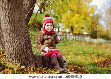 cute and fashion toddler girl  in fall time