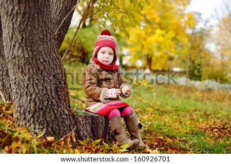 cute and fashion toddler girl in fall time
